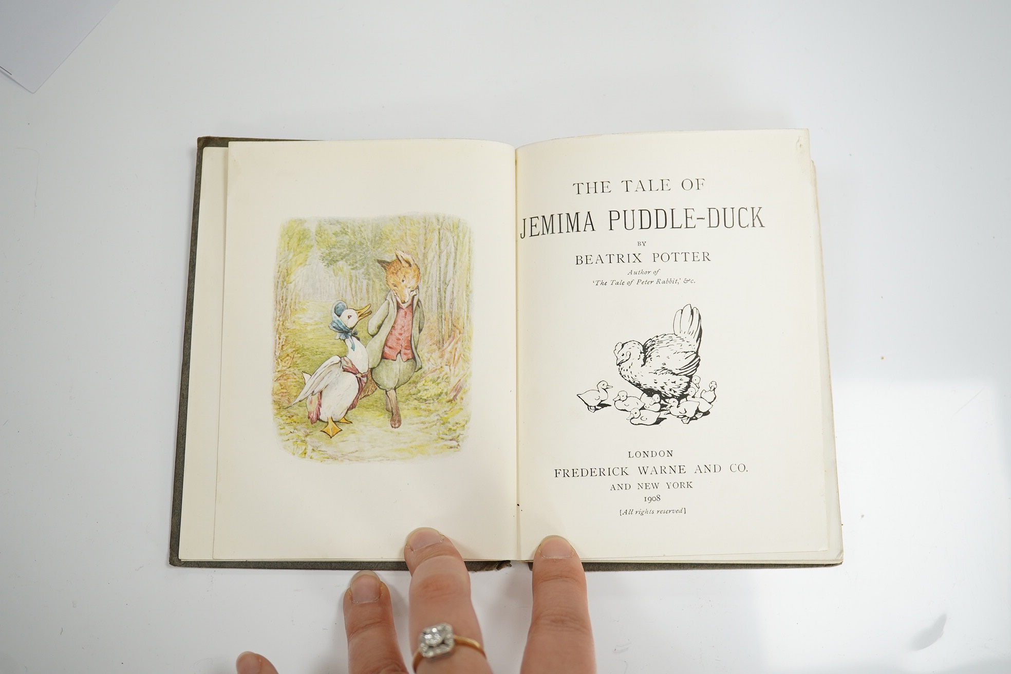 Potter, Beatrix - The Tale of Jemima Puddle-Duck. First Edition. title illus., frontis and 26 other coloured illus.; white lettered grey paperboards with a mounted coloured illus. on upper - having 'arrowhead' shaped cor